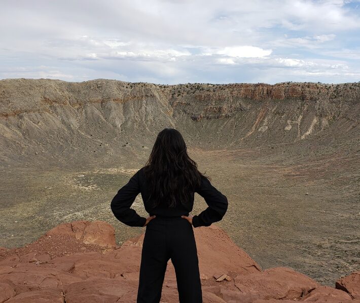 Photo of Dr. Pandya looking over a horizon in nature.